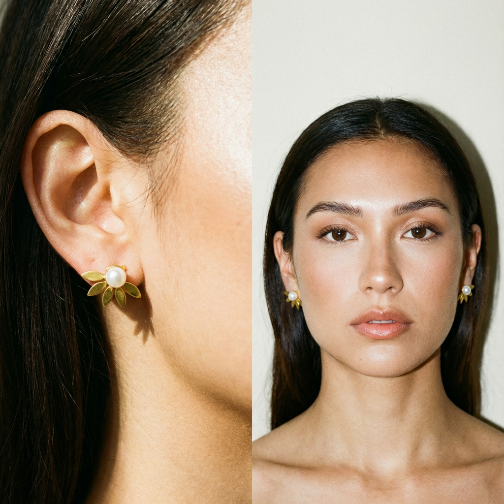 Close Up und Portrait einer Frau mit dunklem langem Haar und Perlensteckerohrringen mit goldenem Fächer