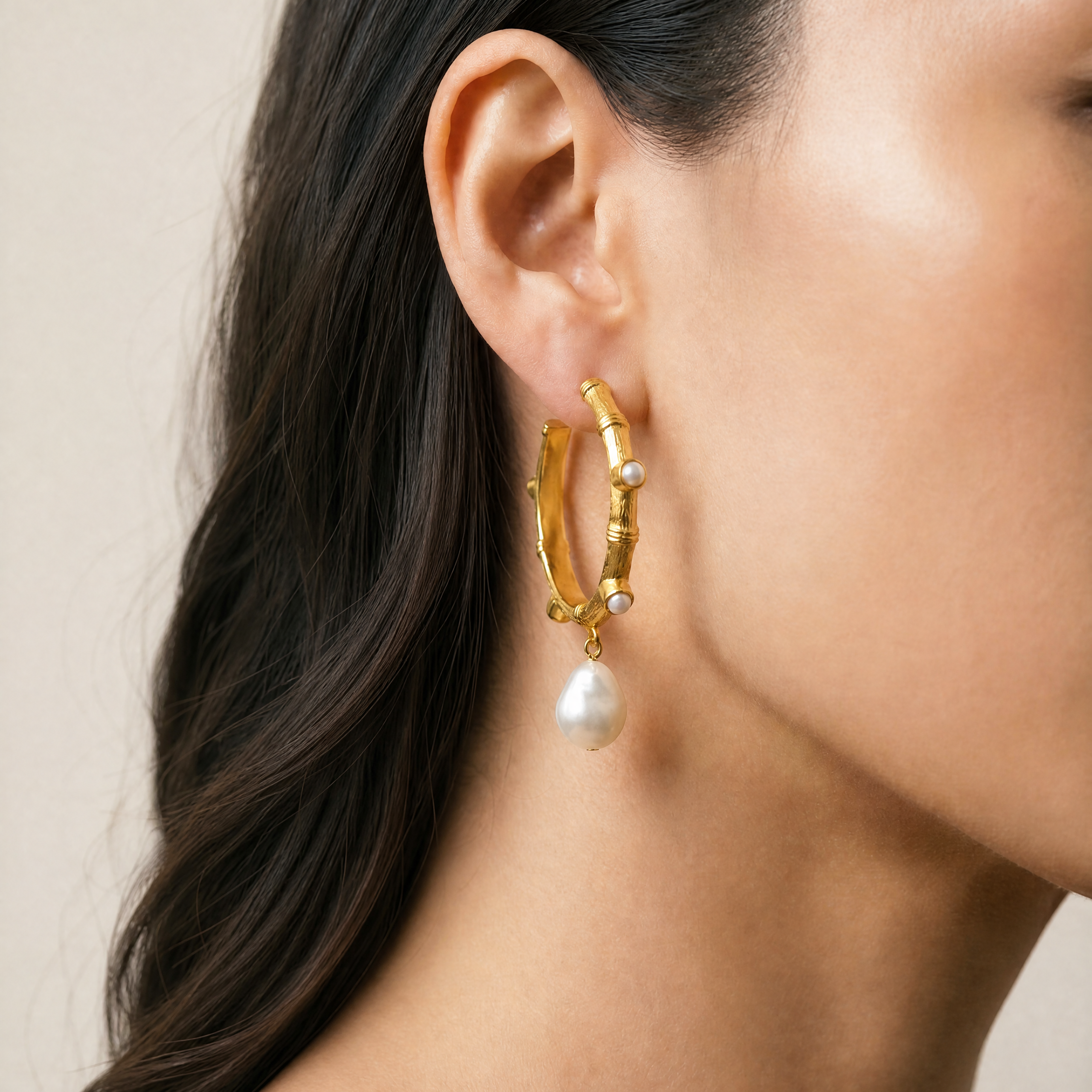 Golden hoop earrings with freshwater pearls